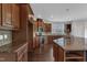 Modern kitchen featuring stainless steel appliances, granite counters and dark wood floors at 664 Long Melford Dr, Rolesville, NC 27571