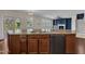 Kitchen with large island, stainless steel appliances and faucet, and breakfast bar at 664 Long Melford Dr, Rolesville, NC 27571