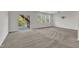 Spacious room with neutral carpet, recessed lighting, and an exterior patio at 664 Long Melford Dr, Rolesville, NC 27571