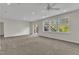 Spacious room featuring neutral carpet, recessed lighting, and exterior windows at 664 Long Melford Dr, Rolesville, NC 27571