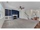 Spacious living room featuring a cozy fireplace, ceiling fan, and staircase at 664 Long Melford Dr, Rolesville, NC 27571