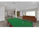 Large recreation room with a pool table, projector, and other furniture at 664 Long Melford Dr, Rolesville, NC 27571
