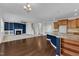 Open floor plan features a cozy fireplace, modern kitchen with granite countertops, and a staircase at 664 Long Melford Dr, Rolesville, NC 27571