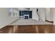 Open living room showcasing a fireplace, staircase, and windows allowing natural light to illuminate the interior at 664 Long Melford Dr, Rolesville, NC 27571
