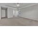 Spacious main bedroom featuring neutral walls, carpet, ceiling fan, and a walk-in closet for ample storage at 664 Long Melford Dr, Rolesville, NC 27571