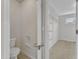 Walk-in closet with built-in shelves and a convenient toilet, offering a practical storage solution at 664 Long Melford Dr, Rolesville, NC 27571