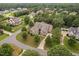 Aerial view of a luxurious house in a tree-lined neighborhood at 7440 Bleasdale Ct, Apex, NC 27539