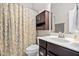 Clean bathroom with patterned shower curtain and dark vanity at 7440 Bleasdale Ct, Apex, NC 27539