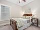 Bright bedroom featuring a wood bed frame and window with blinds at 7440 Bleasdale Ct, Apex, NC 27539