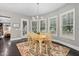 Charming dining area with wood table and access to backyard at 7440 Bleasdale Ct, Apex, NC 27539