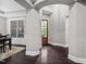 Elegant entryway with dark hardwood floors and a view into the dining area at 7440 Bleasdale Ct, Apex, NC 27539