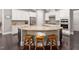 Eat-in kitchen with large island, granite countertops, and stainless steel appliances at 7440 Bleasdale Ct, Apex, NC 27539