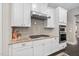 White kitchen cabinets, granite countertops, and stainless steel appliances at 7440 Bleasdale Ct, Apex, NC 27539