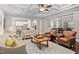 Open concept living room with hardwood floors and views into kitchen at 7440 Bleasdale Ct, Apex, NC 27539
