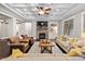 Living room with hardwood floors, stone fireplace and comfortable seating at 7440 Bleasdale Ct, Apex, NC 27539