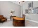 Elegant home office with a curved desk and leather chair at 7440 Bleasdale Ct, Apex, NC 27539