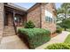 Inviting front porch with rocking chairs, stone facade, and landscaping at 7440 Bleasdale Ct, Apex, NC 27539