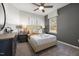 bedroom with striped bed, window and gray accent wall at 776 Denburn Pl, Raleigh, NC 27603