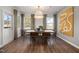 Bright dining area with hardwood floors and large windows at 776 Denburn Pl, Raleigh, NC 27603