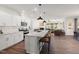 Modern kitchen with white cabinets, granite countertops, and large island at 776 Denburn Pl, Raleigh, NC 27603