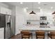 Modern kitchen with white cabinets, granite countertops, and large island at 776 Denburn Pl, Raleigh, NC 27603