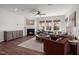 Spacious living room with corner fireplace and large windows at 776 Denburn Pl, Raleigh, NC 27603