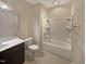 Bathroom with tub, toilet and dark brown vanity at 902 Laurel Gate Dr, Wake Forest, NC 27587