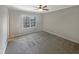 Bright bedroom featuring carpet, large window, and ceiling fan at 902 Laurel Gate Dr, Wake Forest, NC 27587