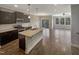 Open kitchen with island, stainless steel appliances, and hardwood floors at 902 Laurel Gate Dr, Wake Forest, NC 27587