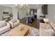 Virtually staged living room with kitchen view at 902 Laurel Gate Dr, Wake Forest, NC 27587