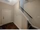 Staircase with hardwood floors and neutral walls at 902 Laurel Gate Dr, Wake Forest, NC 27587