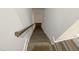 Modern staircase with wood treads and dark wood railing at 902 Laurel Gate Dr, Wake Forest, NC 27587