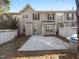 A cozy townhouse backyard featuring a concrete patio and privacy fence, perfect for outdoor enjoyment at 9412 Harvest Acres Ct, Raleigh, NC 27617