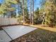 Backyard patio featuring a built-in grill and mature trees at 9412 Harvest Acres Ct, Raleigh, NC 27617