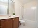 Bathroom featuring vanity, mirror, toilet and shower with tub at 9412 Harvest Acres Ct, Raleigh, NC 27617