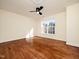 Bedroom featuring a ceiling fan and large window that lets in plenty of natural light at 9412 Harvest Acres Ct, Raleigh, NC 27617
