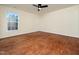 Bedroom with hardwood floor and ceiling fan is bright from the natural light at 9412 Harvest Acres Ct, Raleigh, NC 27617