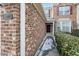 Charming townhouse exterior showcasing brick accents and a welcoming entrance for guests at 9412 Harvest Acres Ct, Raleigh, NC 27617