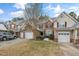 Attractive townhouse facade with a well-manicured lawn, attached garages, and inviting curb appeal at 9412 Harvest Acres Ct, Raleigh, NC 27617