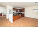Modern kitchen featuring stainless steel appliances, granite countertops, wood cabinets, and an island open to the living area at 9412 Harvest Acres Ct, Raleigh, NC 27617