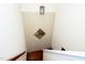 View of stairway with a modern light fixture and unique tile design at 9412 Harvest Acres Ct, Raleigh, NC 27617