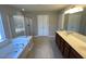 Elegant bathroom with double vanity and soaking tub at 1012 Fulbright Dr, Morrisville, NC 27560