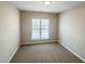 Charming bedroom with a large window and neutral walls at 1012 Fulbright Dr, Morrisville, NC 27560