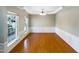 Bright dining room featuring hardwood floors and wainscoting at 1012 Fulbright Dr, Morrisville, NC 27560