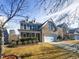 Brick two-story house with a white garage door and landscaping at 1012 Fulbright Dr, Morrisville, NC 27560