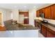 Modern kitchen with granite countertops and wood cabinets at 1012 Fulbright Dr, Morrisville, NC 27560