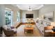 Spacious living room with hardwood floors and large windows at 1012 Fulbright Dr, Morrisville, NC 27560