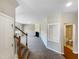 Spacious living room with fireplace and neutral carpeting at 1012 Fulbright Dr, Morrisville, NC 27560