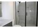 Modern bathroom featuring a glass shower with black trim and a gray tile surround at 1021 Smoke Willow Way # 130, Rolesville, NC 27571