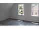 Bright bedroom featuring two windows offering a view of the outdoor greenery at 1021 Smoke Willow Way # 130, Rolesville, NC 27571